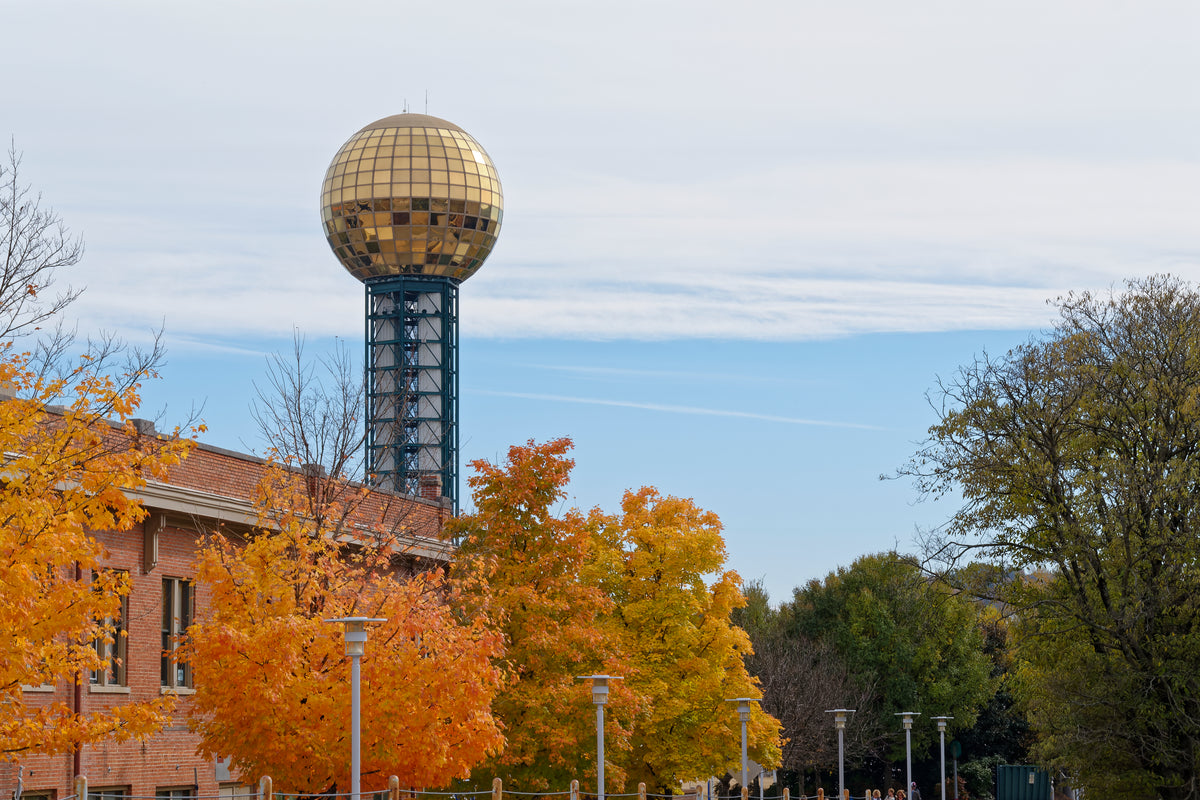 The gold Sunsphere above autumn trees in World's Fair Park, Knoxville, Tennessee